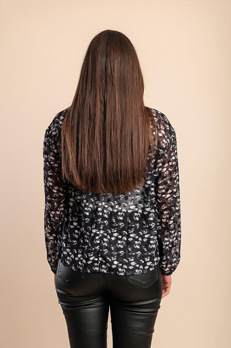Blusa semitrasparente a fantasia