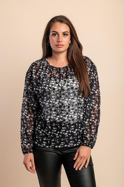 Blusa semitrasparente a fantasia
