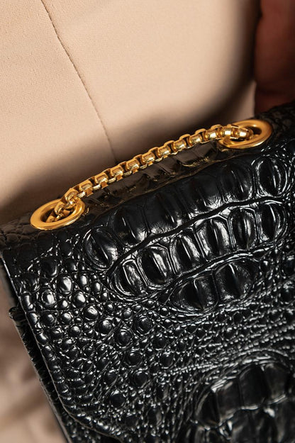 Small bag with crocodile skin pattern